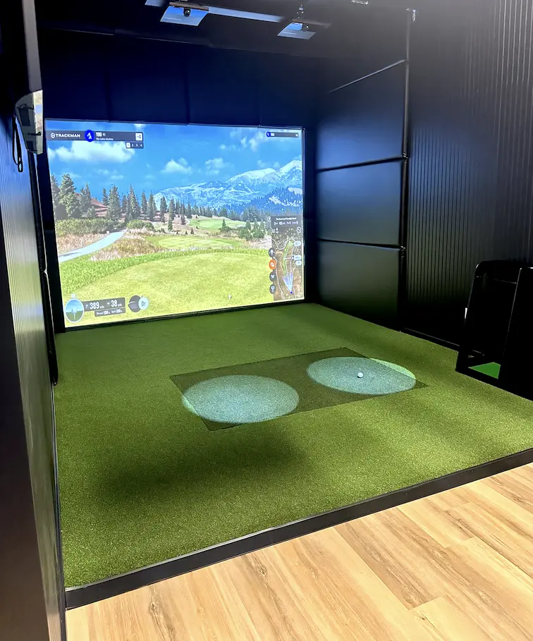 Bay 3, the private members bay at Pin High, with dual TrackMan IO hitting mats for right and left handed golfers