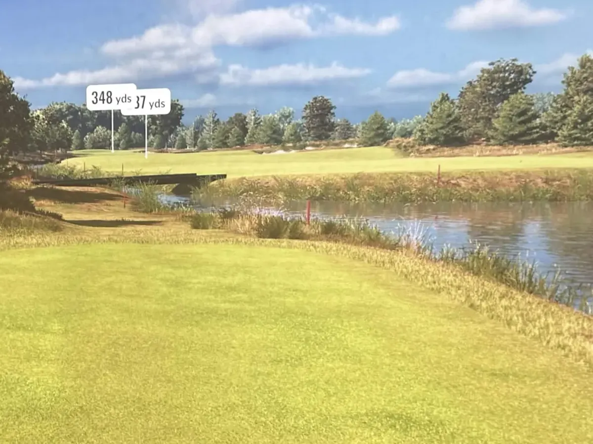 A TrackMan simulator round on a Pin High bay screen: a tee shot view down a fairway beside a pond